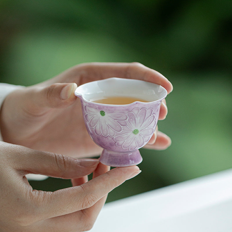 this is a purple ceramic teapot