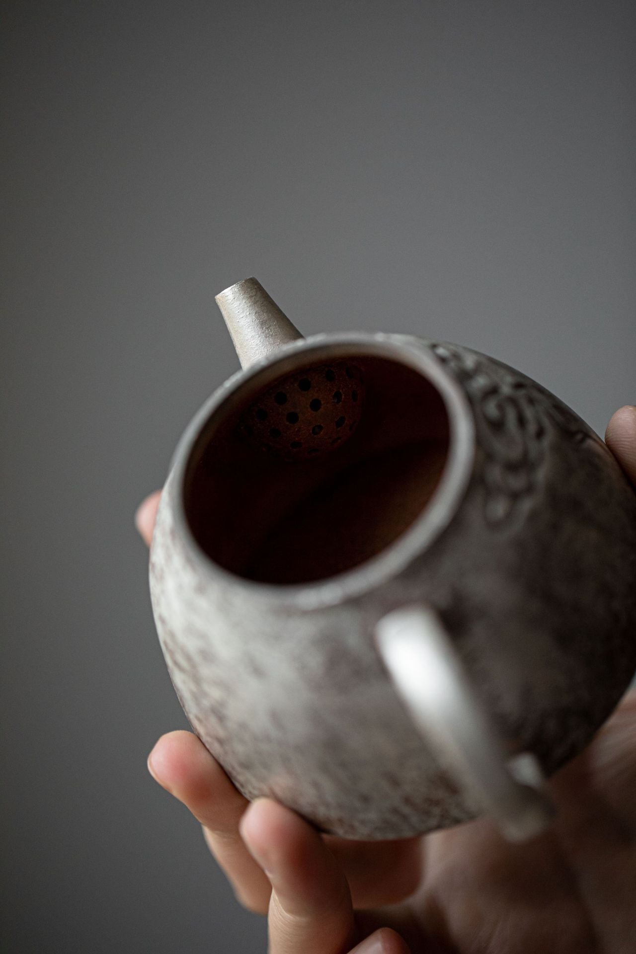 This is a gilted silver pottery teapot