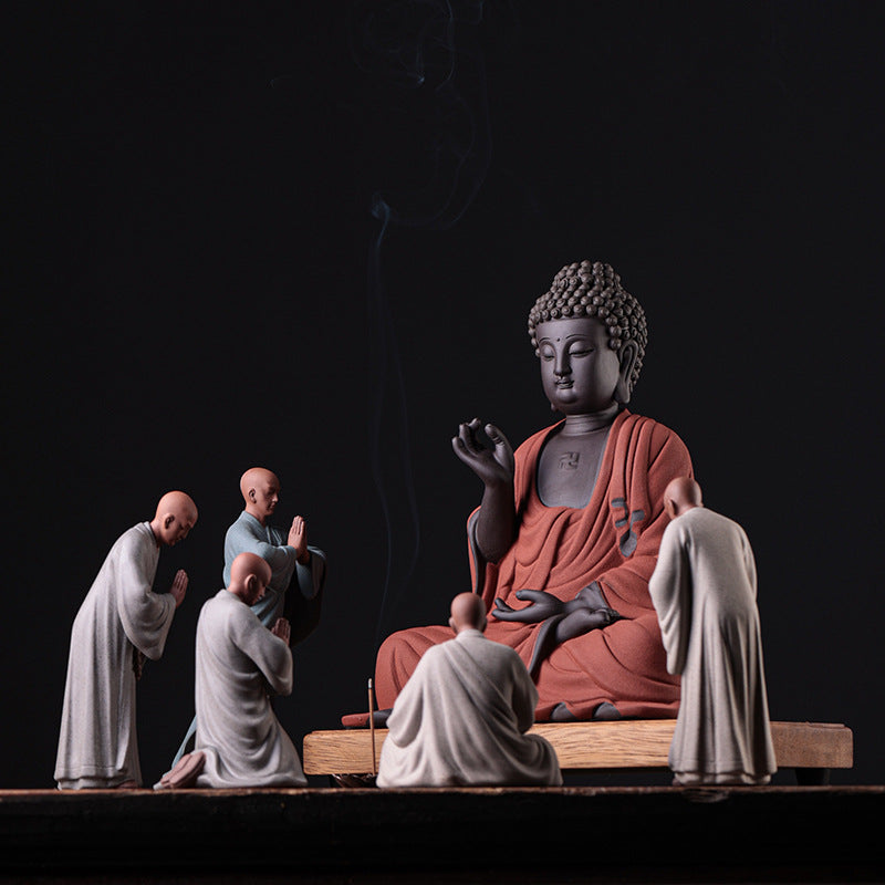 this is a pottery monk sculpture