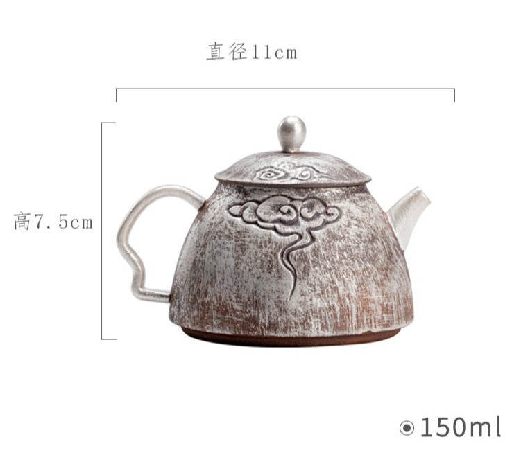 This is a gilted silver pottery teapot