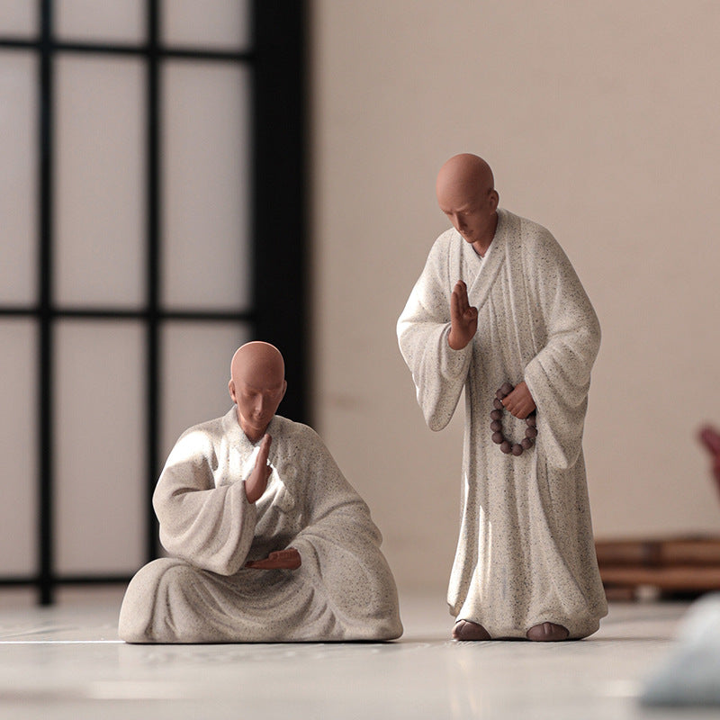 this is a pottery monk sculpture
