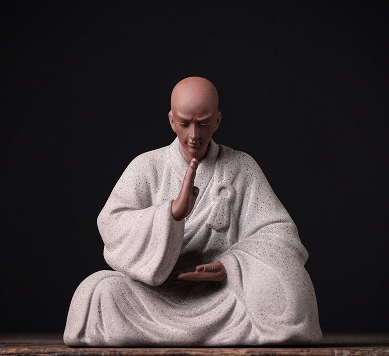 this is a pottery monk sculpture