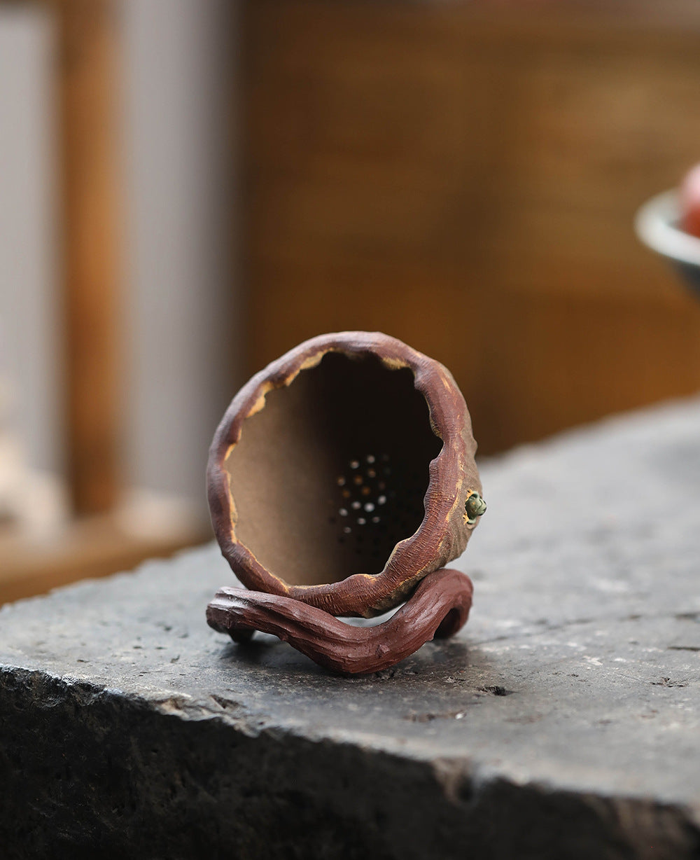 This is a Yixing tea filter.this is Chinese yixing clay tea funnel