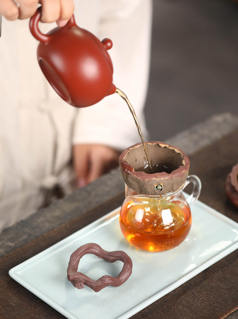 This is a Yixing tea filter.this is Chinese yixing clay tea funnel