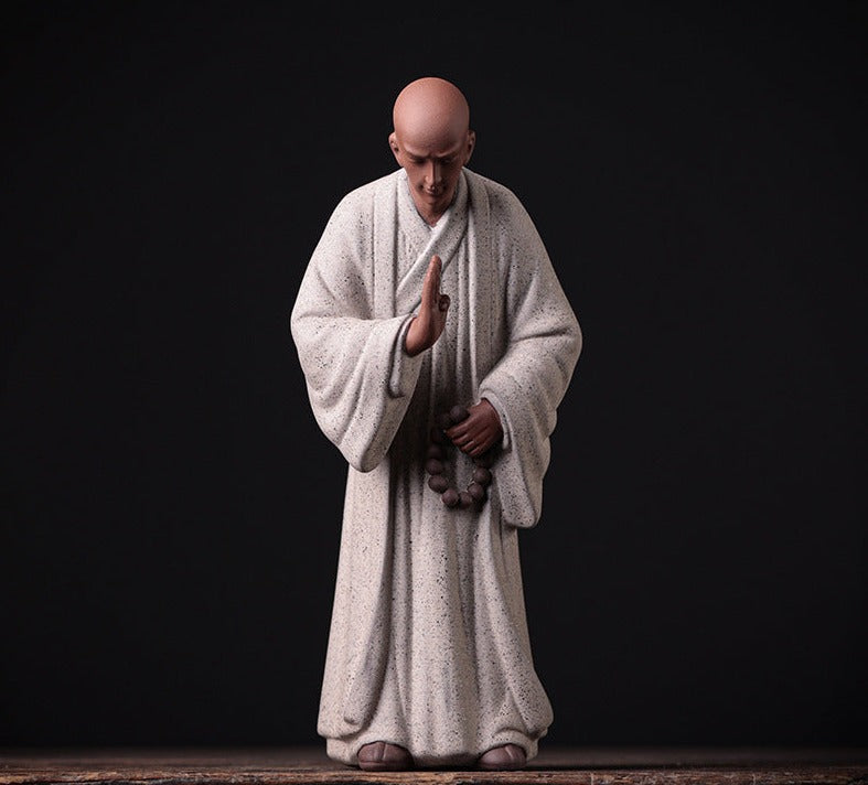 this is a pottery monk sculpture