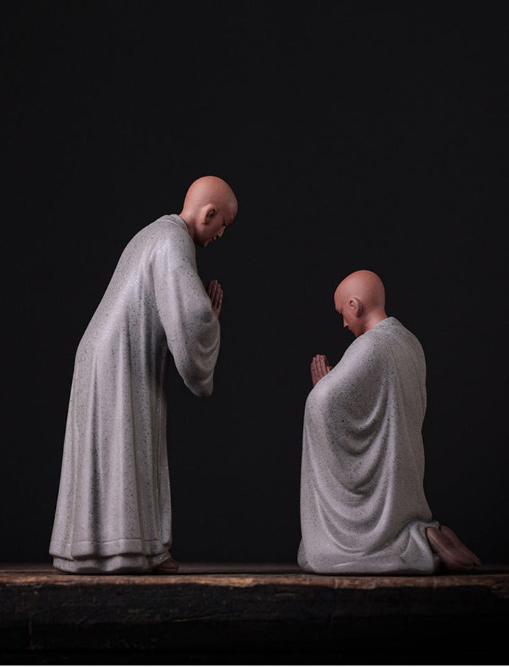 this is a pottery monk sculpture