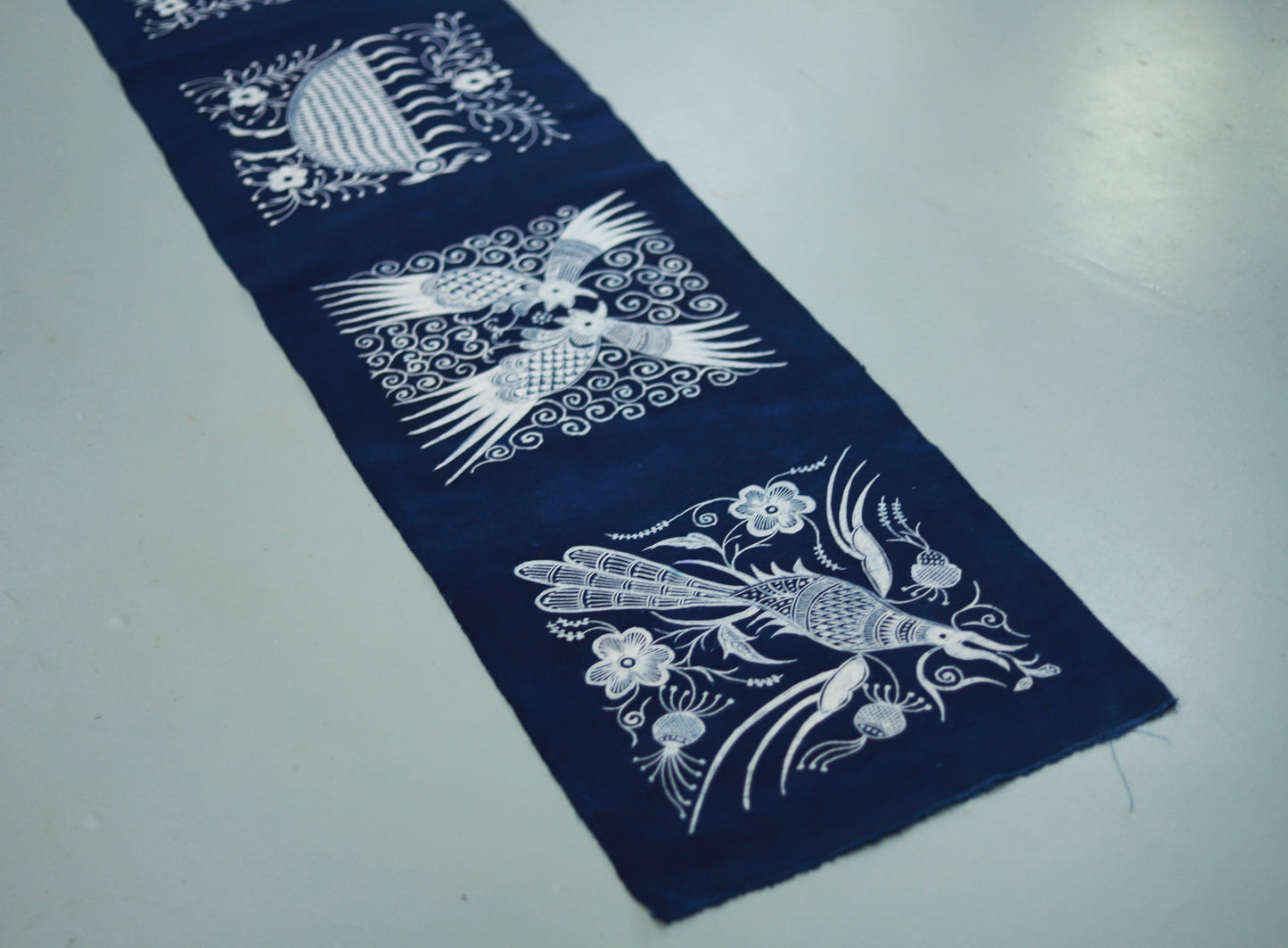 This is a Chinese Miao style batik table cloth tea mat