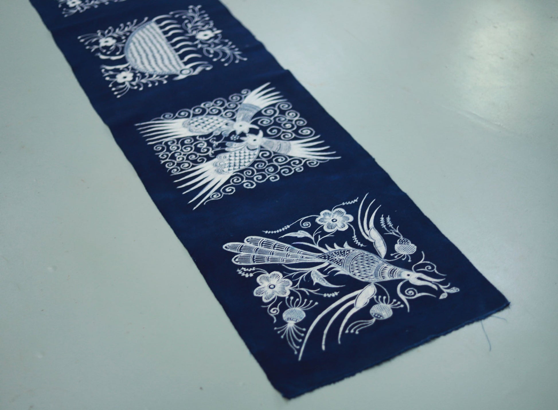 This is a Chinese Miao style batik table cloth tea mat