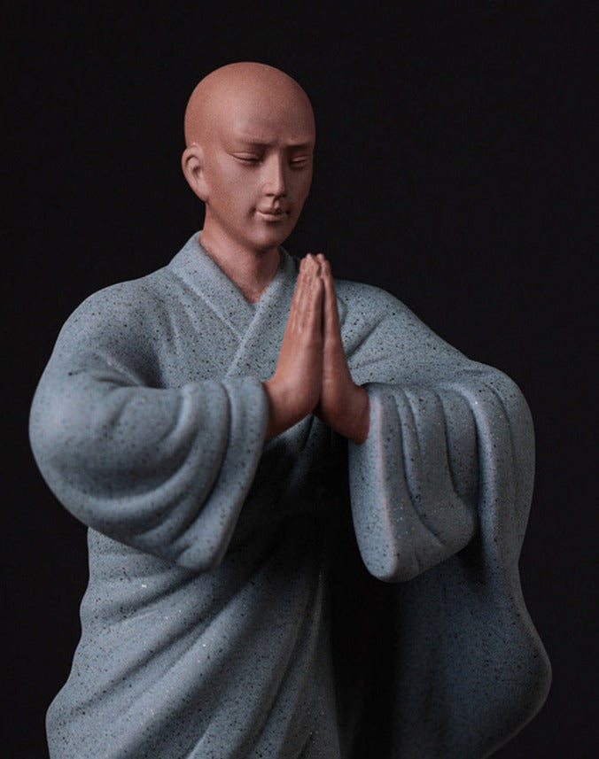this is a pottery monk sculpture