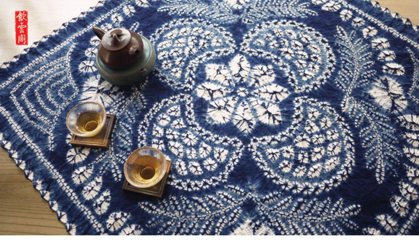 This is a tie-dyed tea mat table cloth