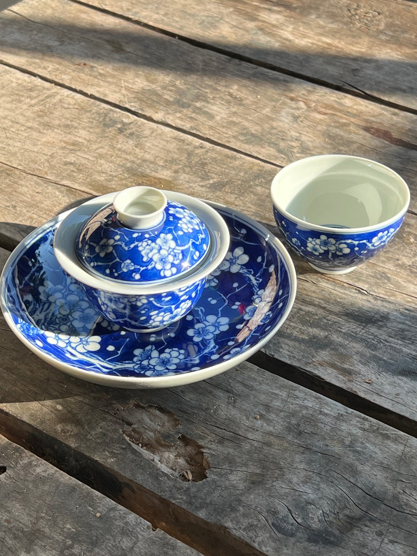 This is Chinese Jingdezhen blue and white porcelain gaiwan. This is a ceramic plum flower teapot