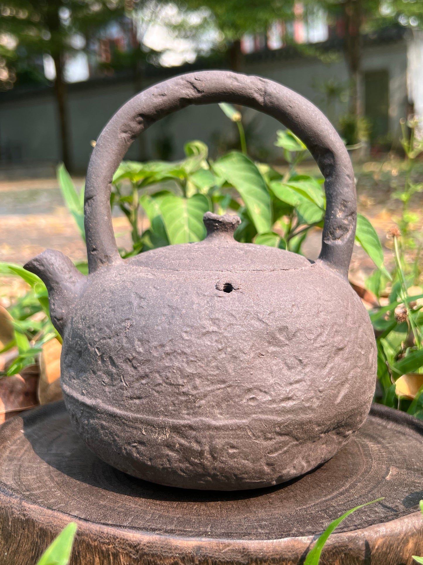 This is a pottery lifting handle kettle