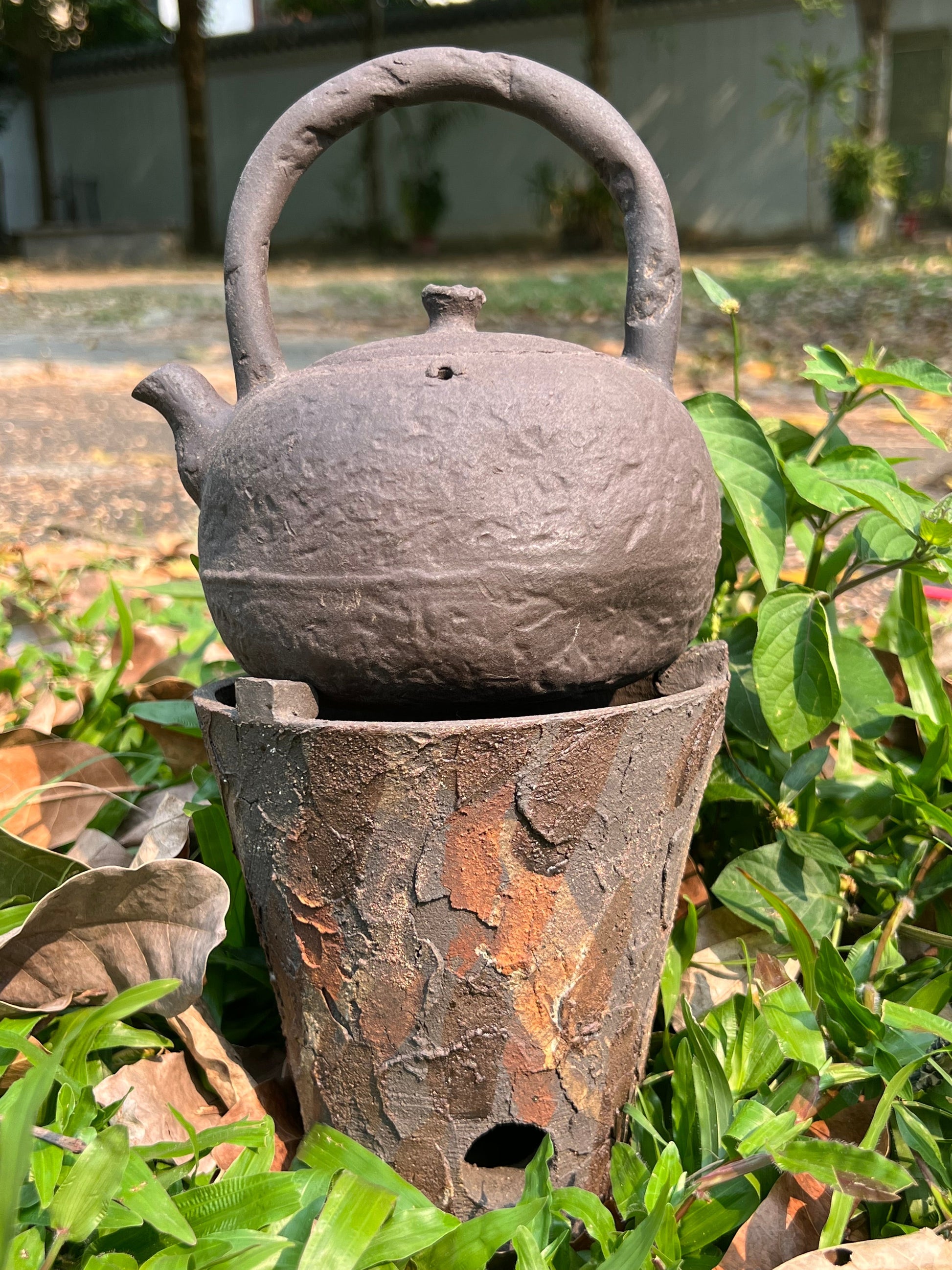 This is a pottery lifting handle kettle