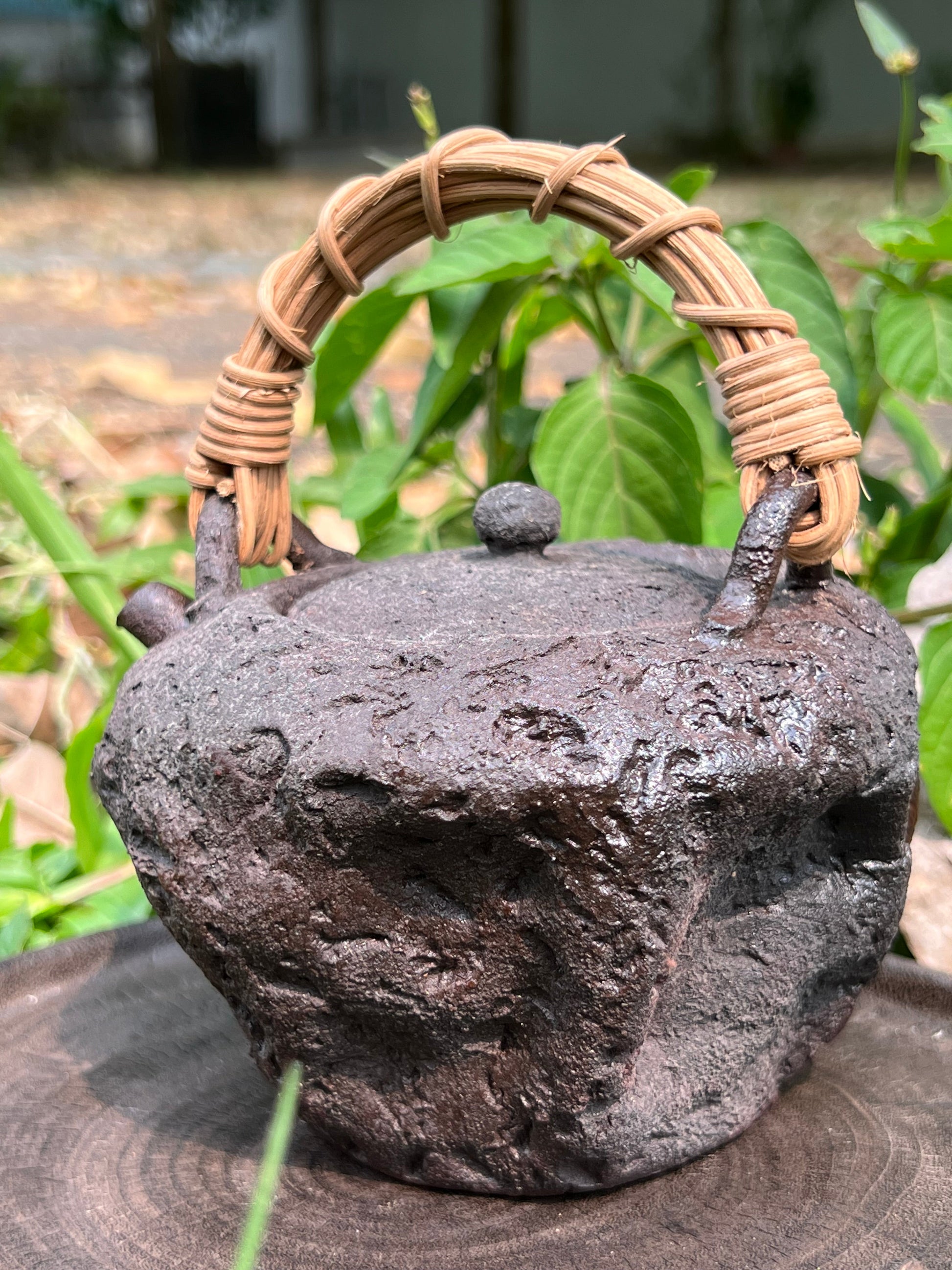 This is a pottery lifting handle kettle