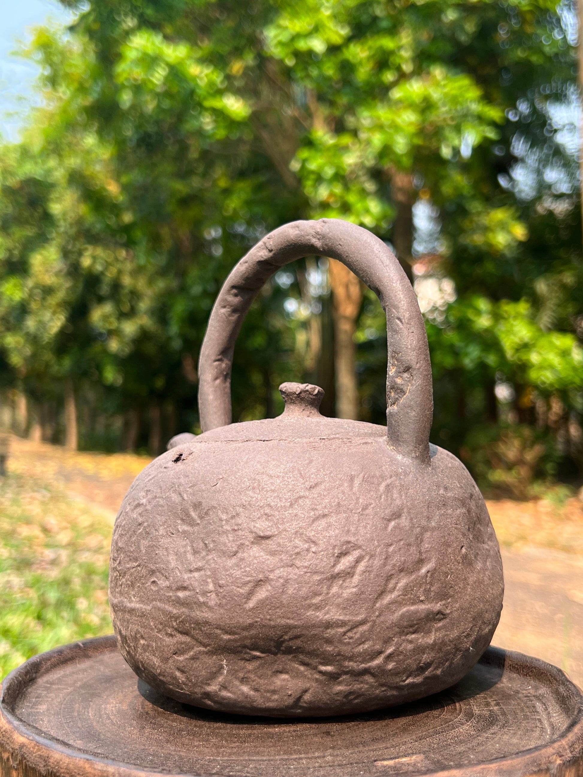 This is a pottery lifting handle kettle