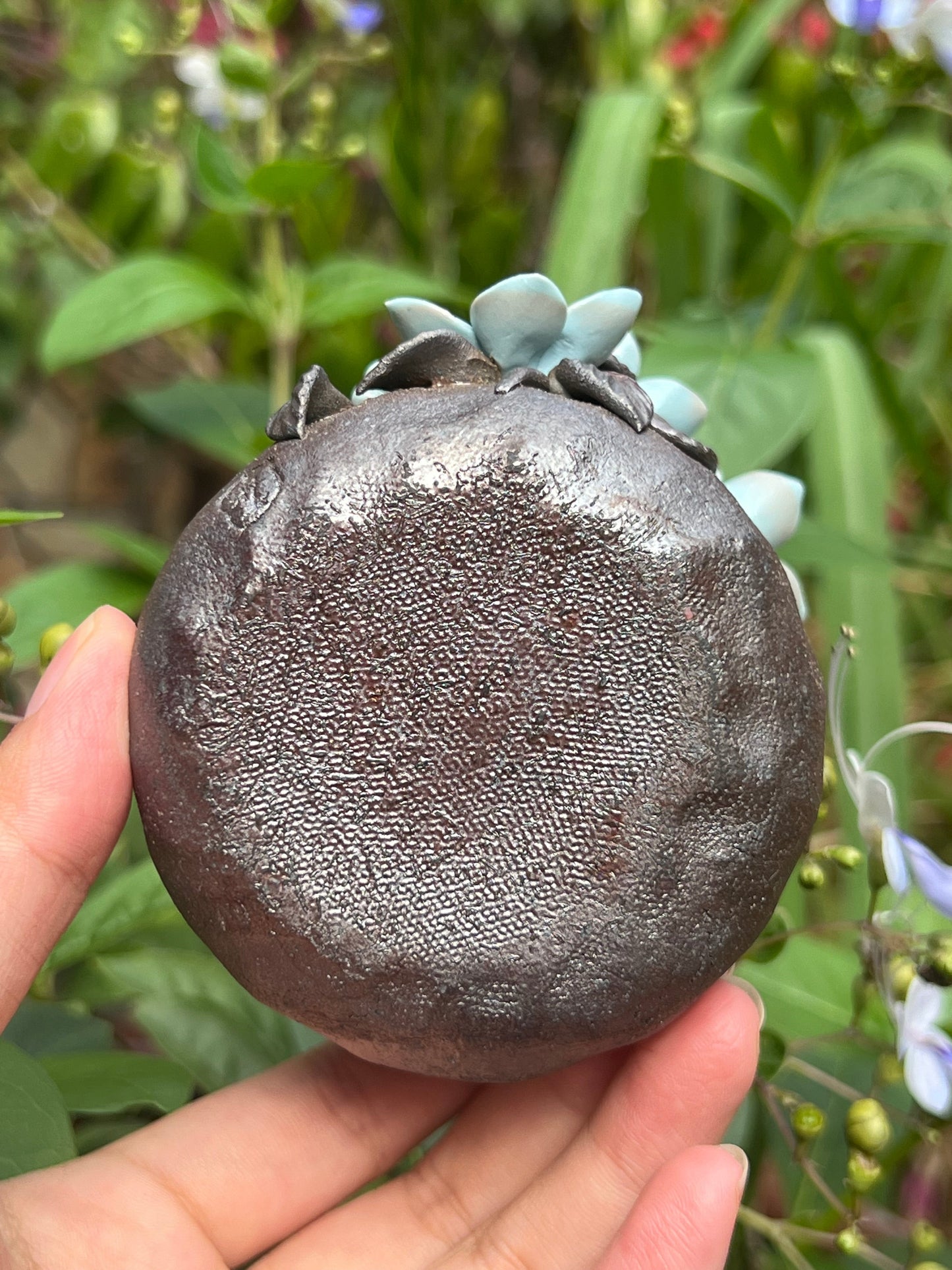 This is a woodfired tietai pottery flower teacup