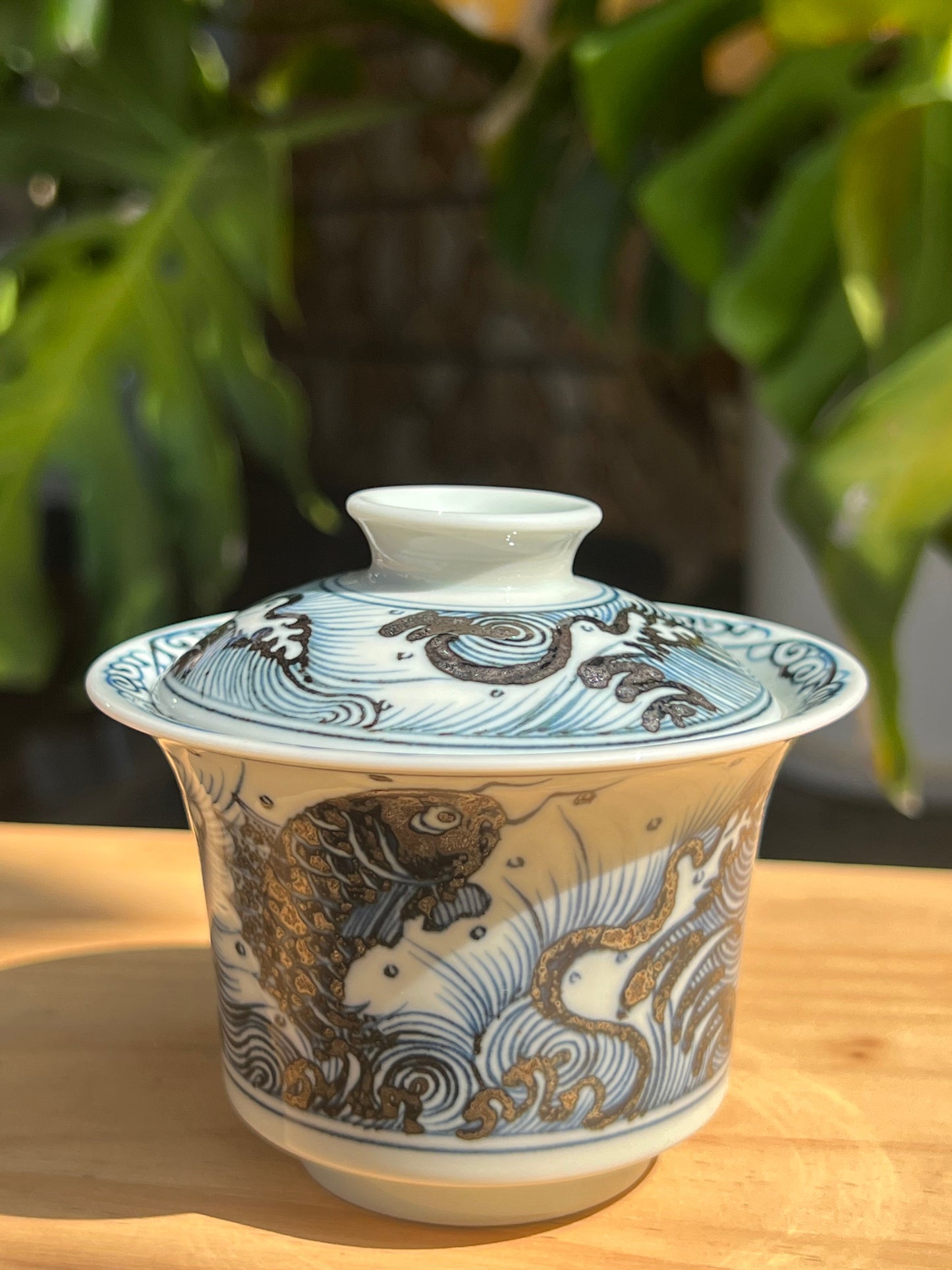 This is a Chinese Jingdezhen blue and white porcelain dragon teapot gaiwan