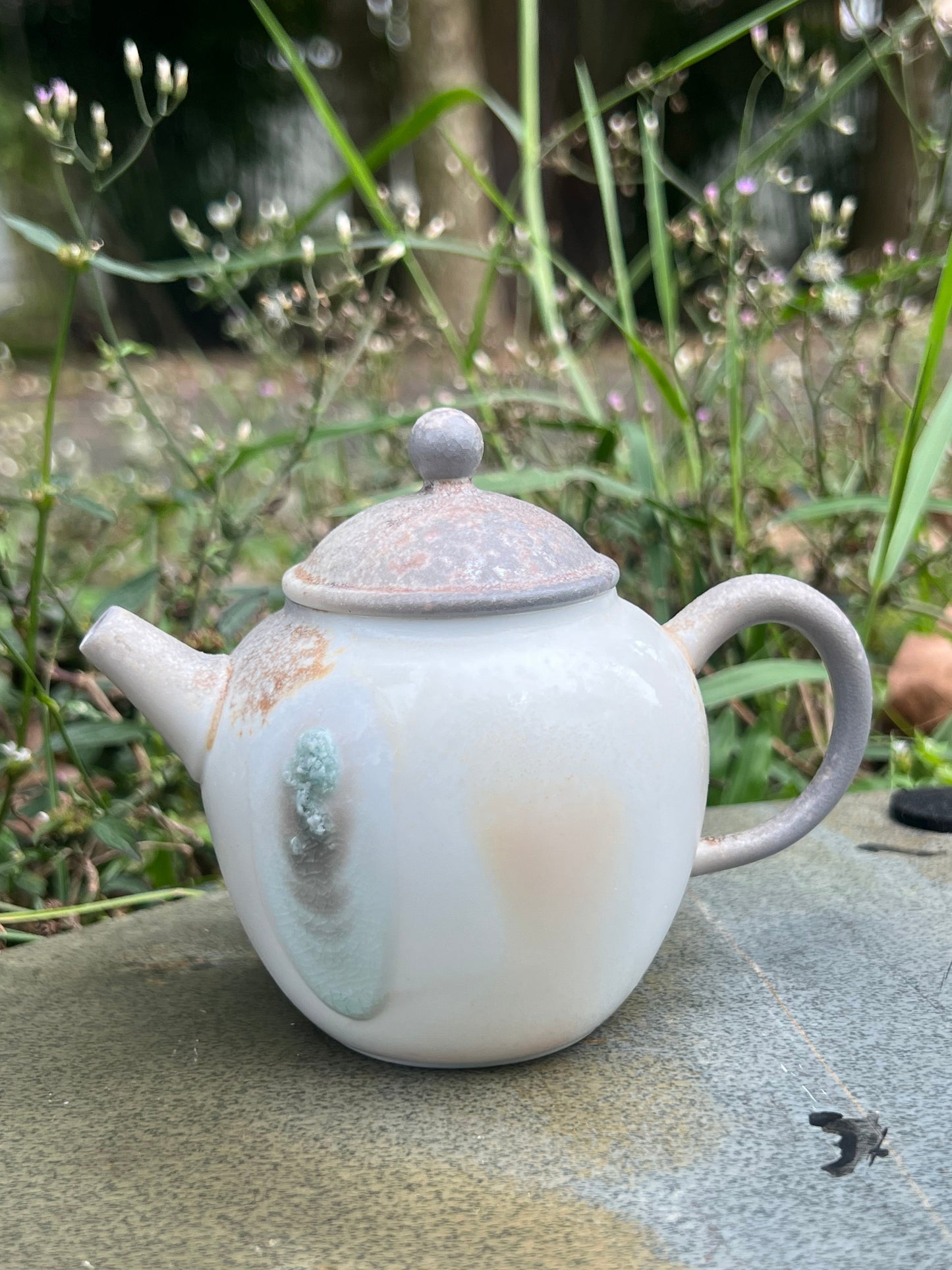 This is a pottery teapot