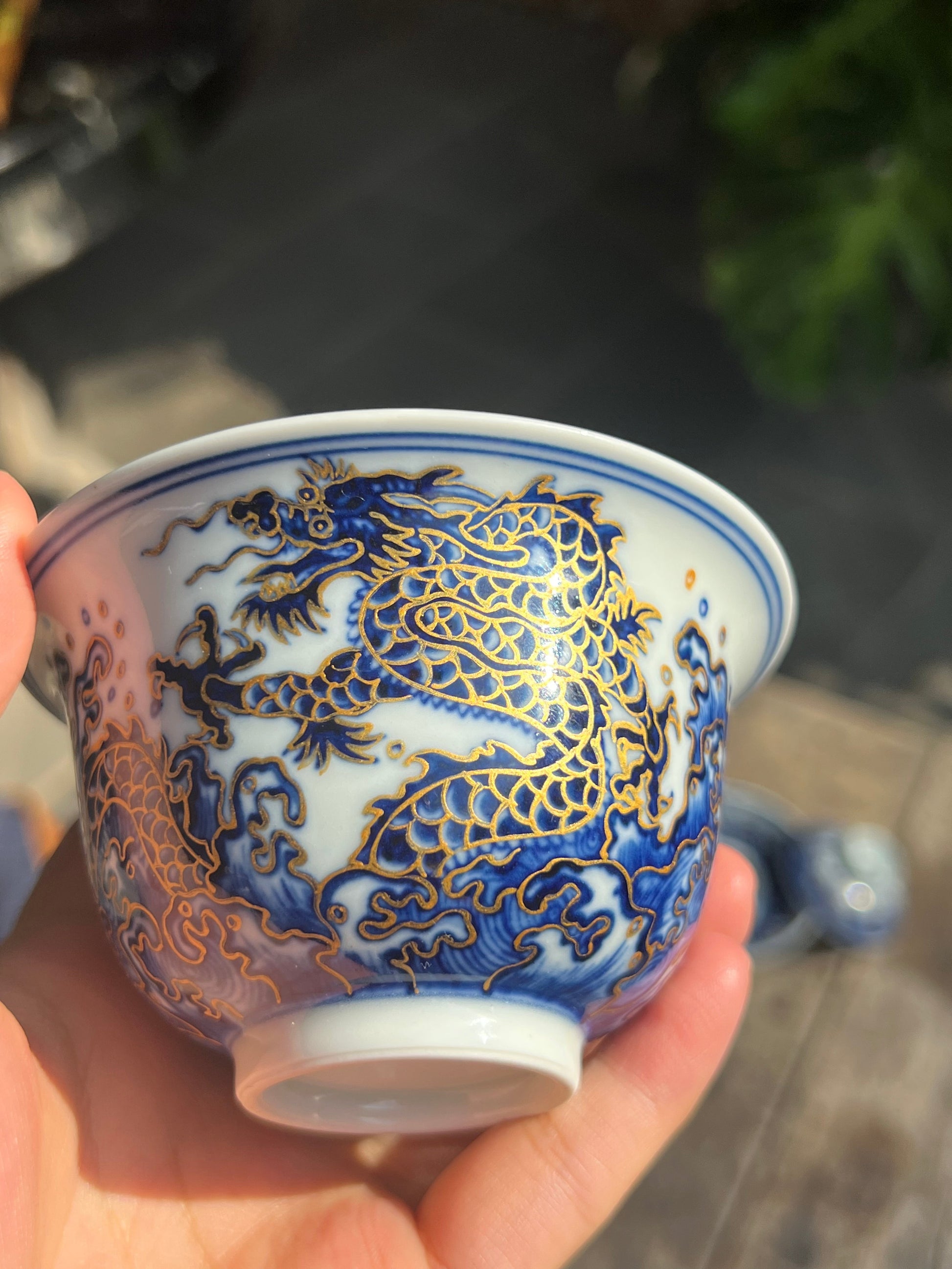This is a Chinese Jingdezhen blue and white porcelain dragon teapot gaiwan