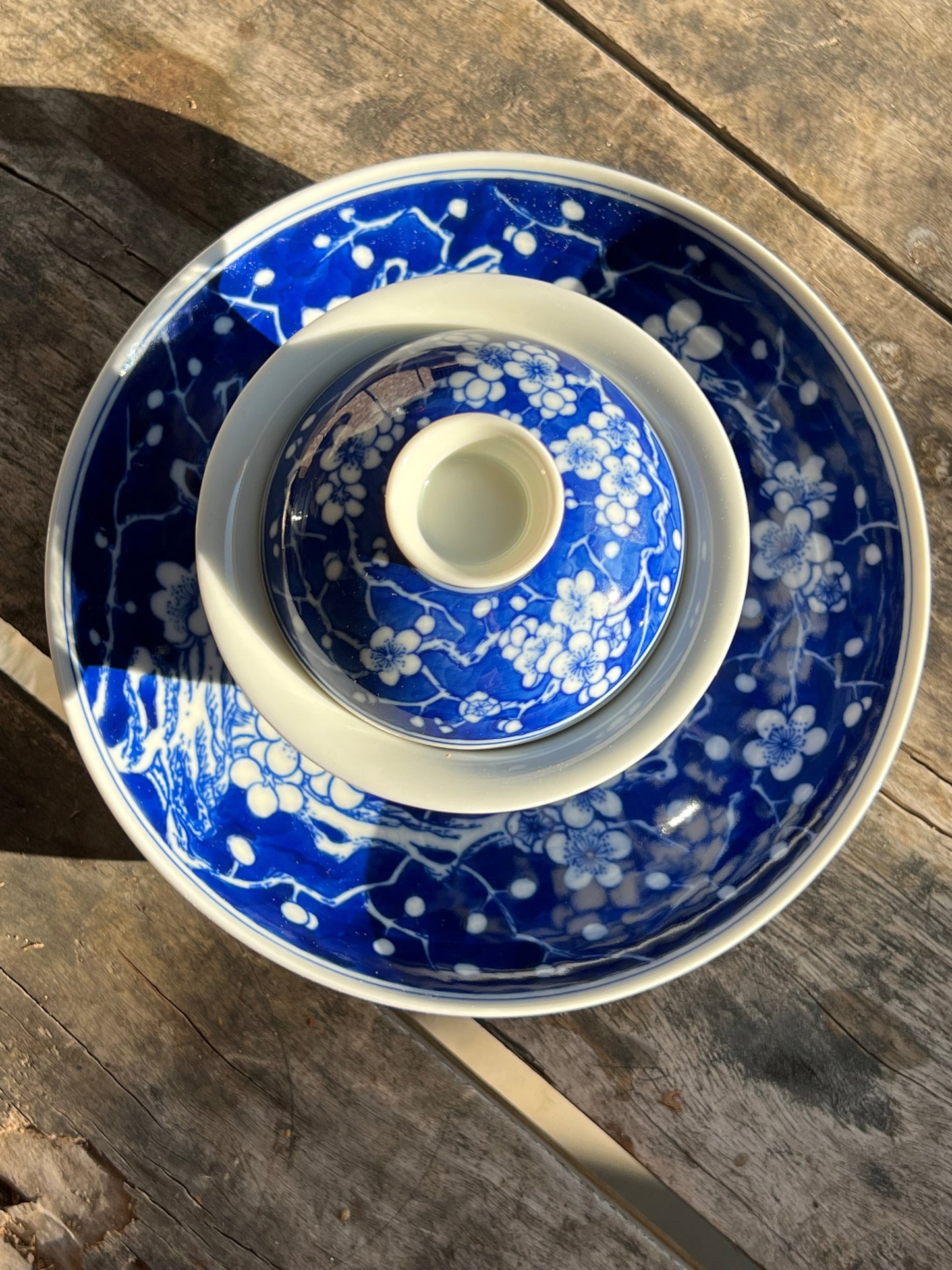 This is Chinese Jingdezhen blue and white porcelain gaiwan. This is a ceramic plum flower teapot
