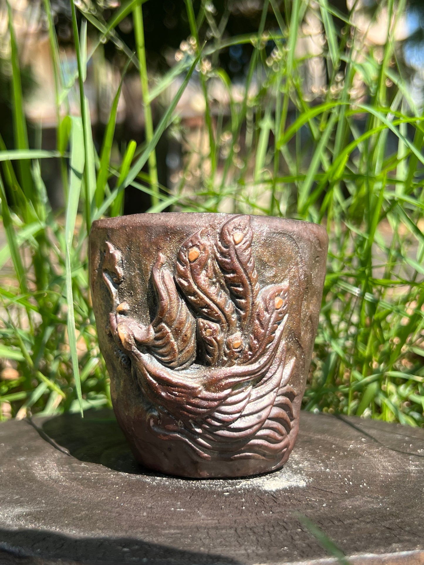 This is a woodfired tietai pottery phoenix teacup