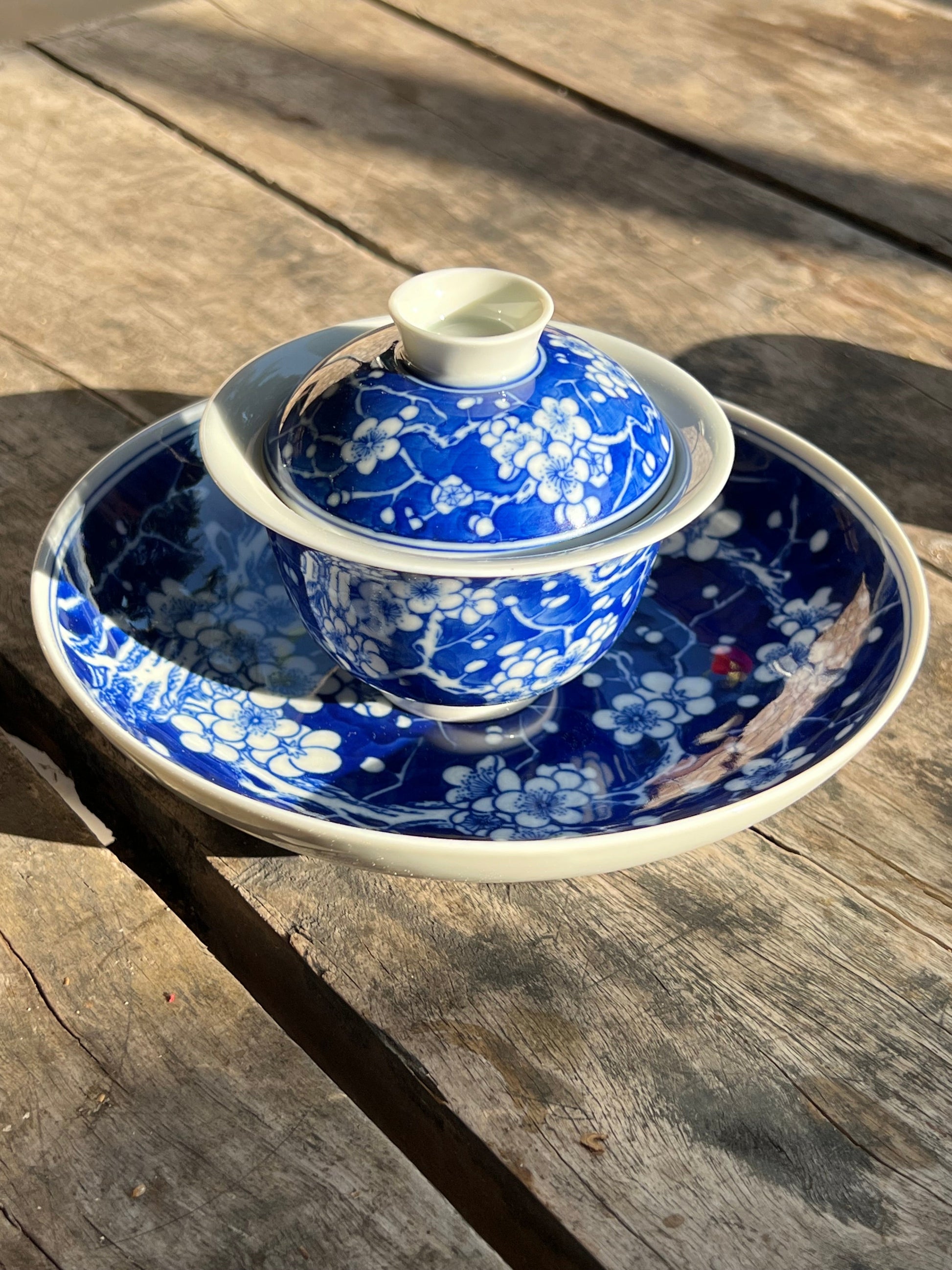 This is Chinese Jingdezhen blue and white porcelain gaiwan. This is a ceramic plum flower teapot