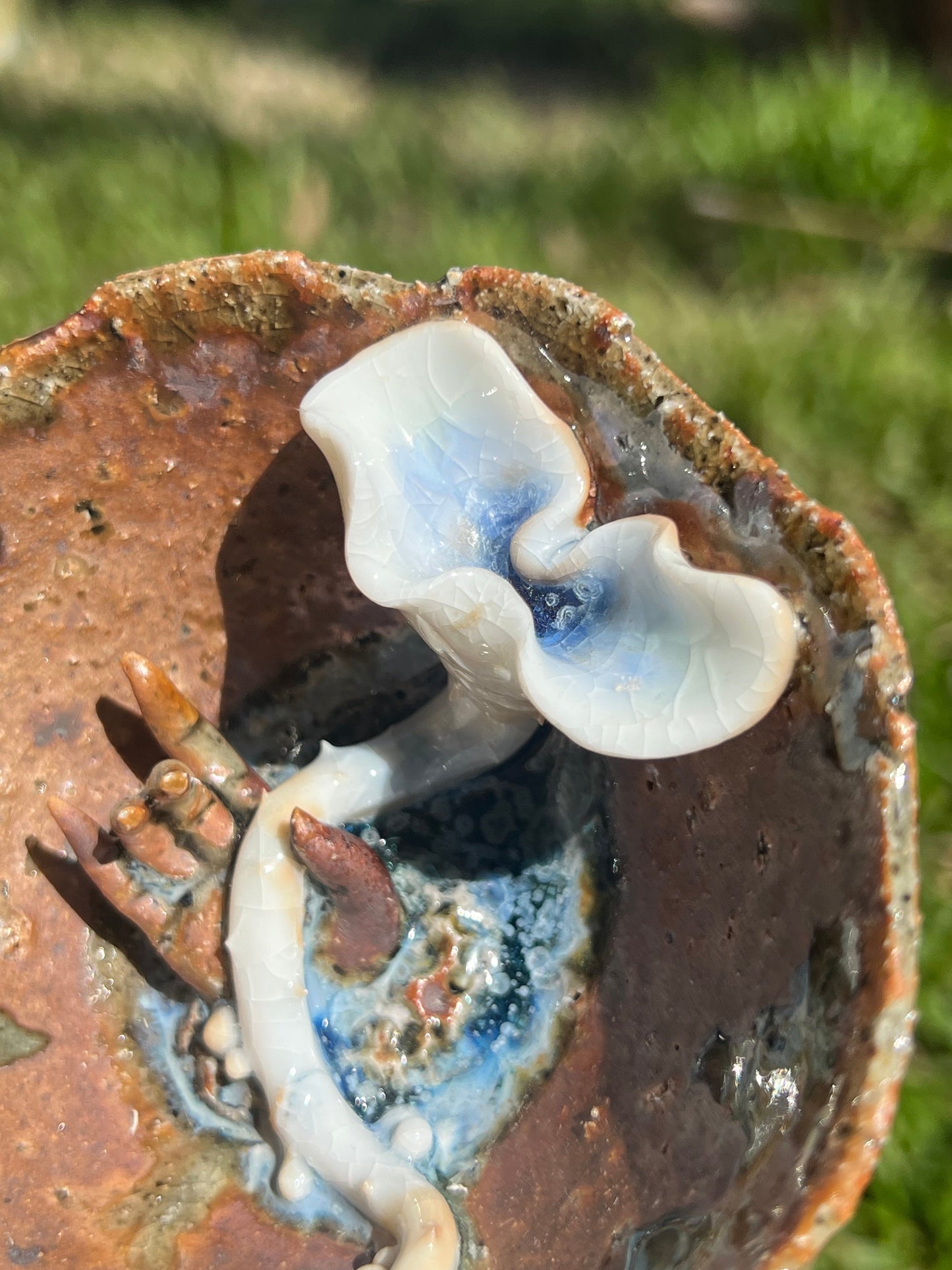 This is a woodfired pottery flower teacup