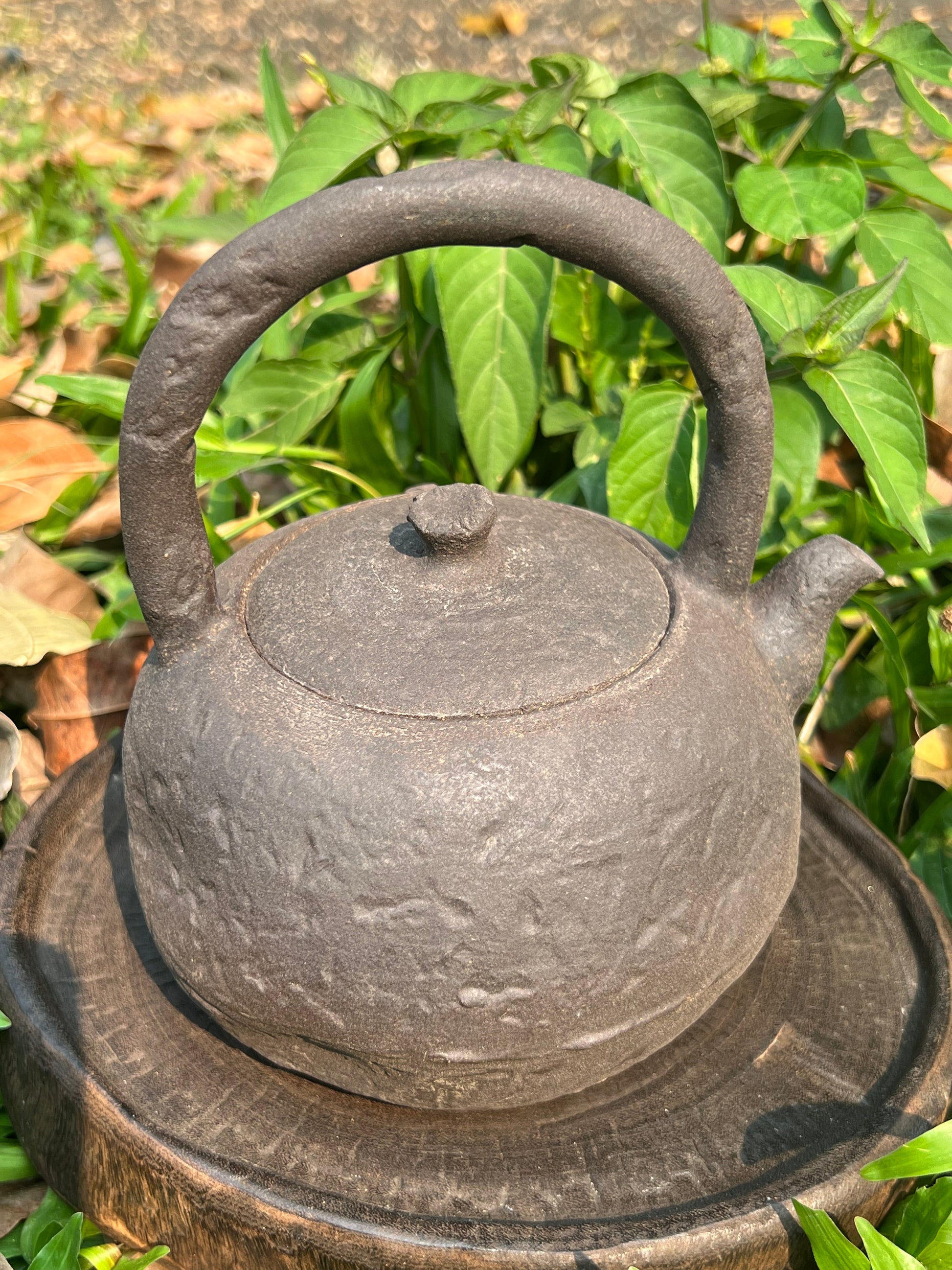 This is a pottery lifting handle kettle
