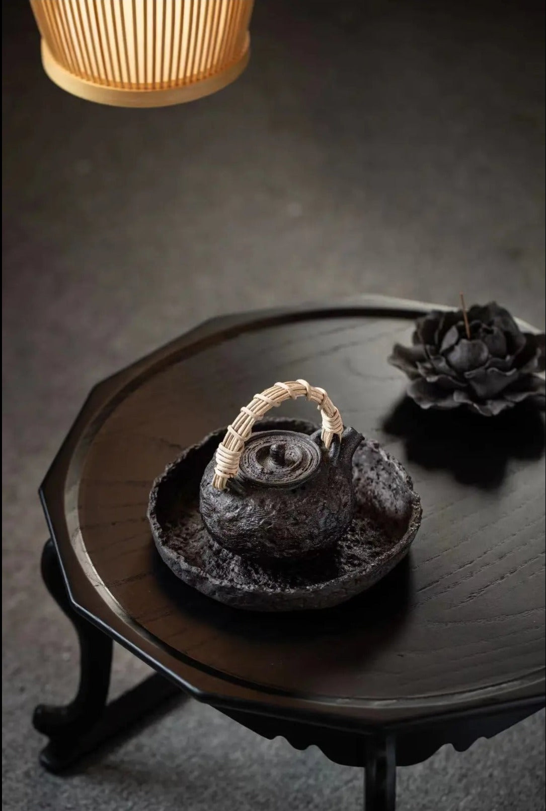 This is a pottery lifting handle kettle