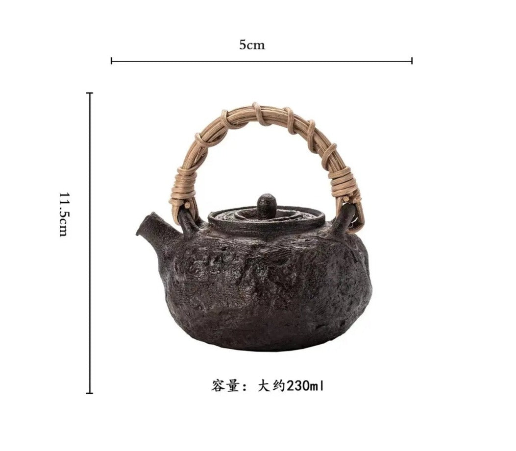 This is a pottery lifting handle kettle