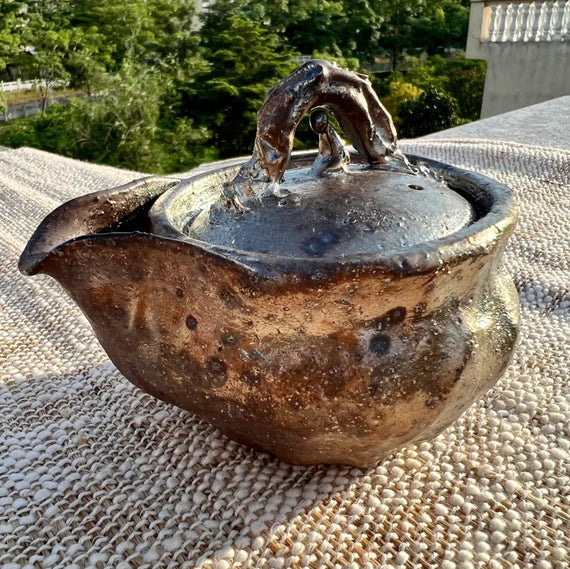 This is a pottery teapot
