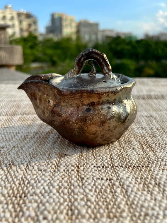 This is a pottery teapot