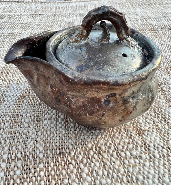 This is a pottery teapot