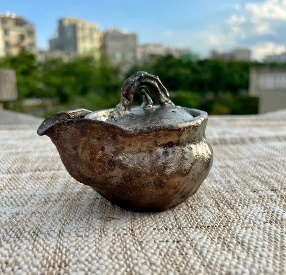 This is a pottery teapot