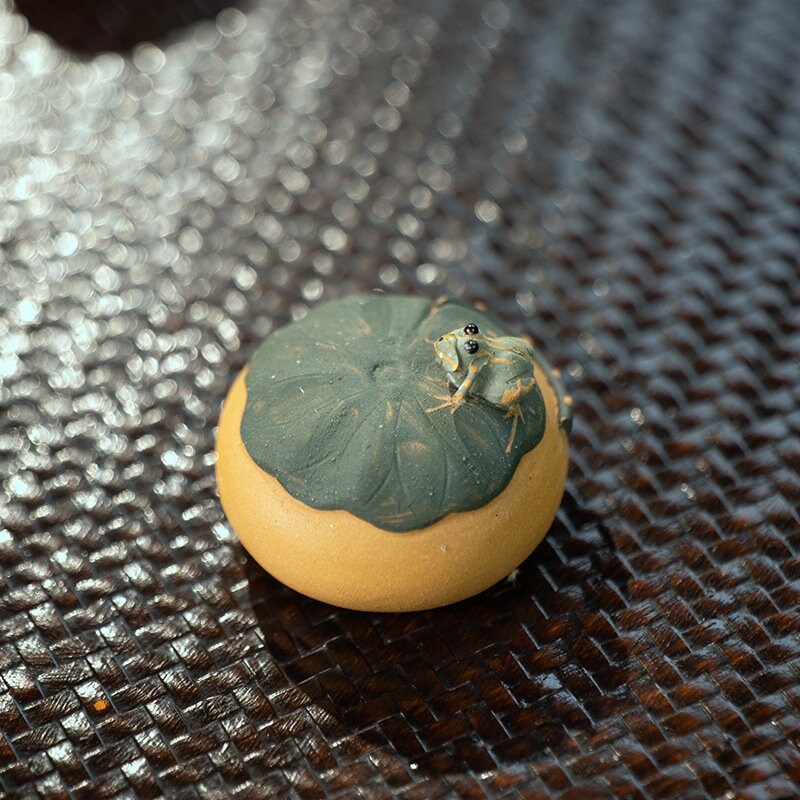 This is a Yixing purple clay water spray frog teapet