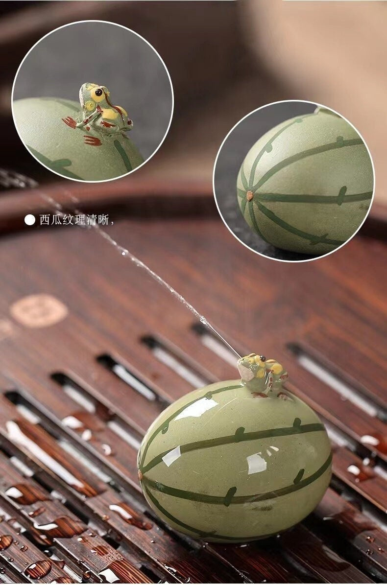 This is a Yixing purple clay water spray frog teapet