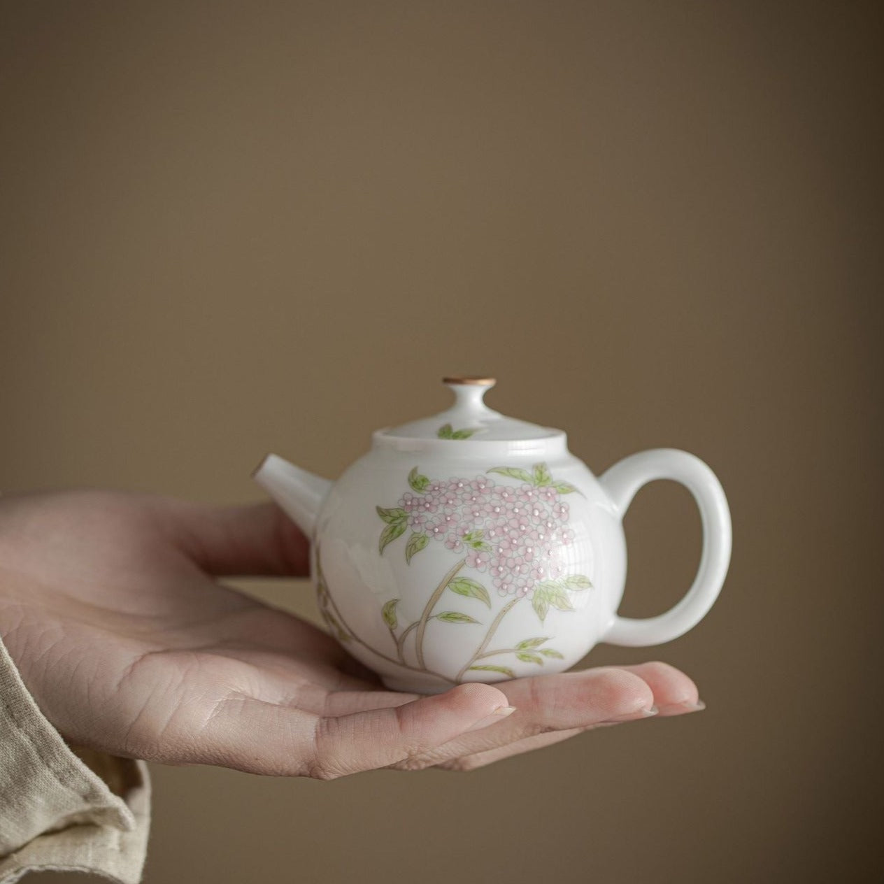 This is a ceramic teapot