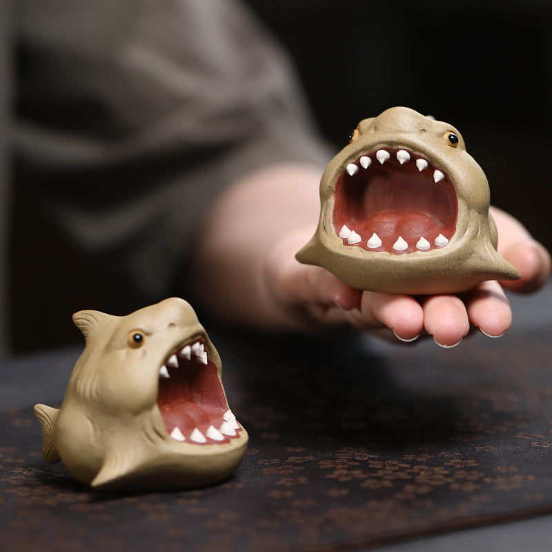 This is Chinese Yixing purple clay shark teapet