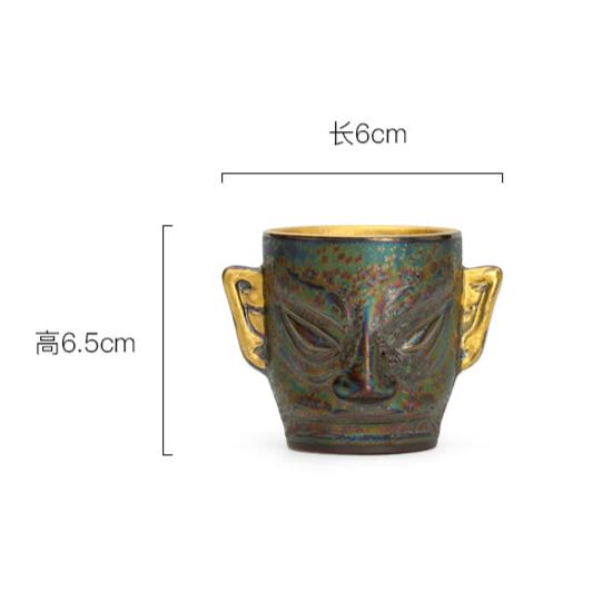 This is a gilded gold Sanxingdui teacup. this is a pottery teacup