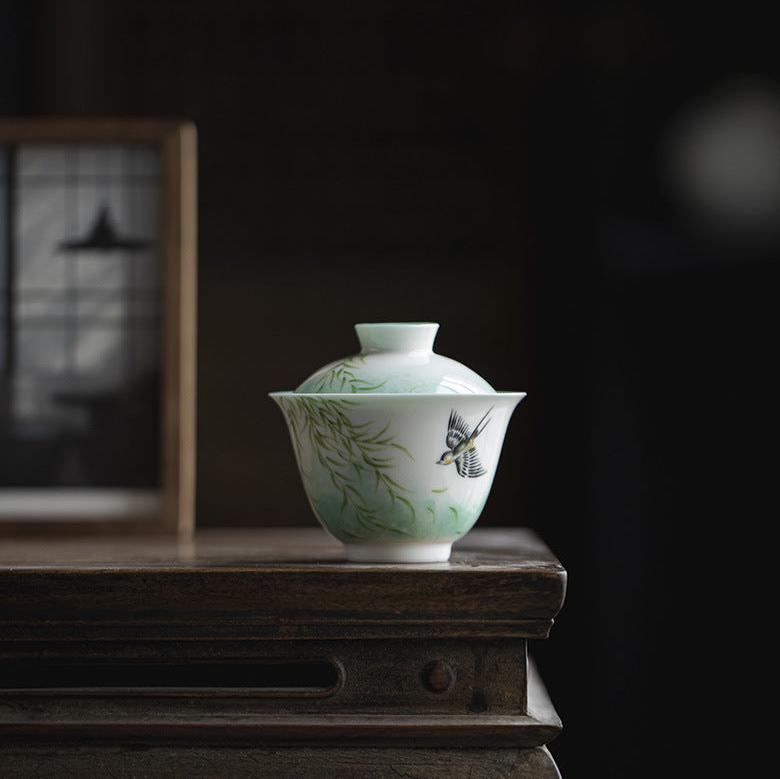 this is a ceramic teapot. this is a green gaiwan