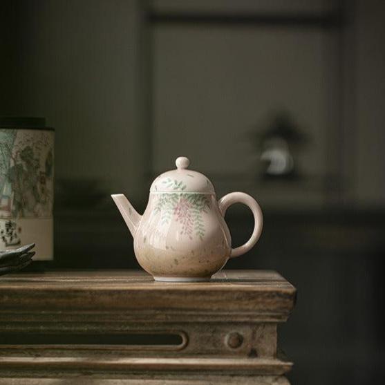 this is a ceramic teapot. this is a pink teapot