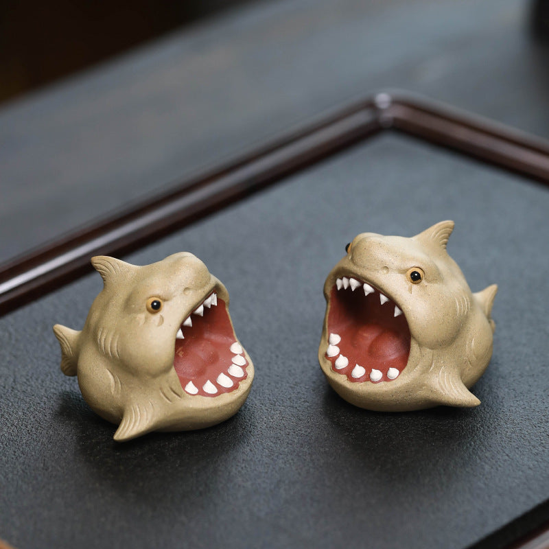 This is Chinese Yixing purple clay shark teapet