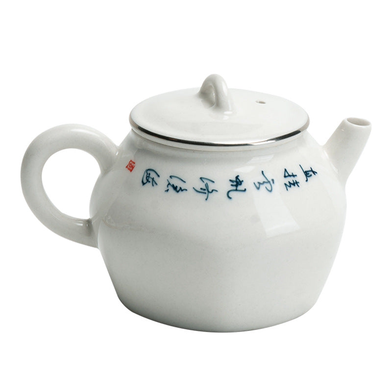 this is a white ceramic teapot