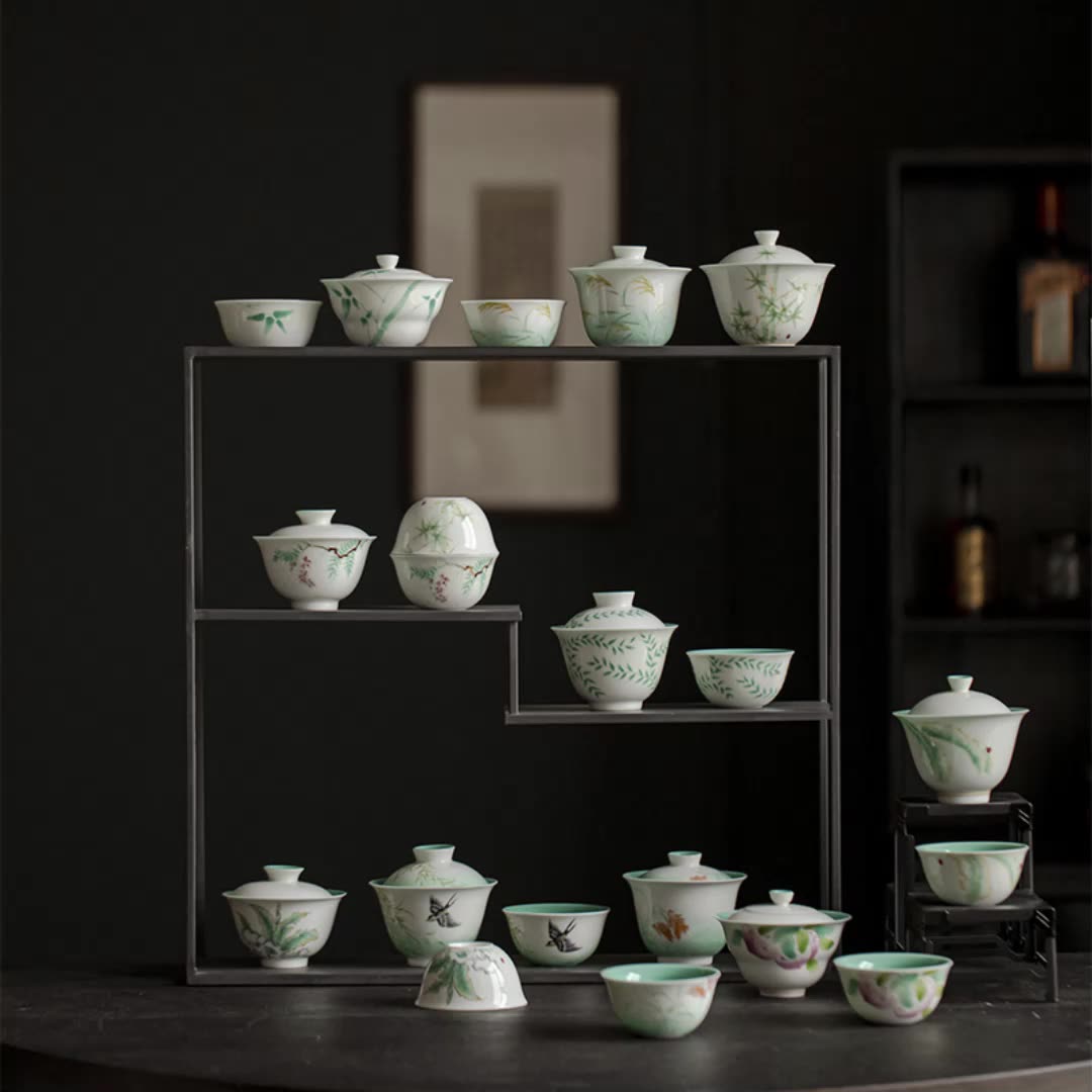 this is a ceramic teapot. this is a green gaiwan