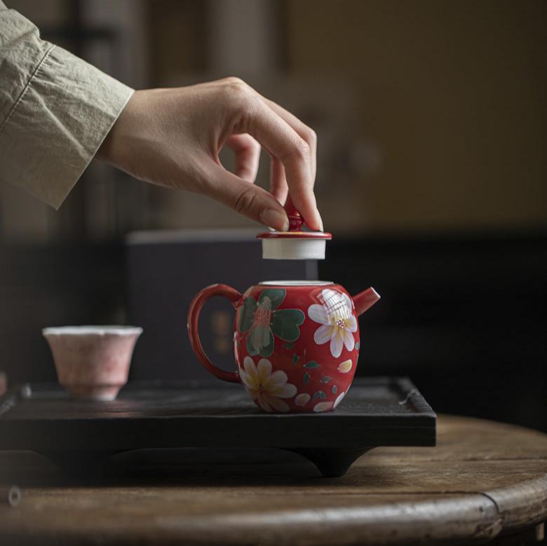 this is a ceramic teapot. this is a red teapot