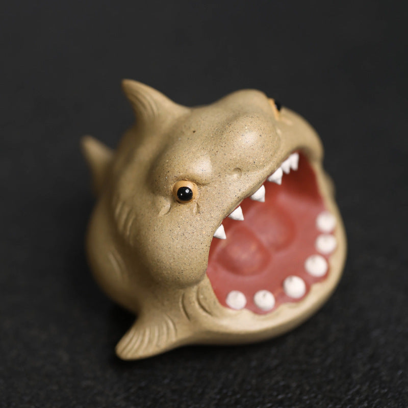 This is Chinese Yixing purple clay shark teapet