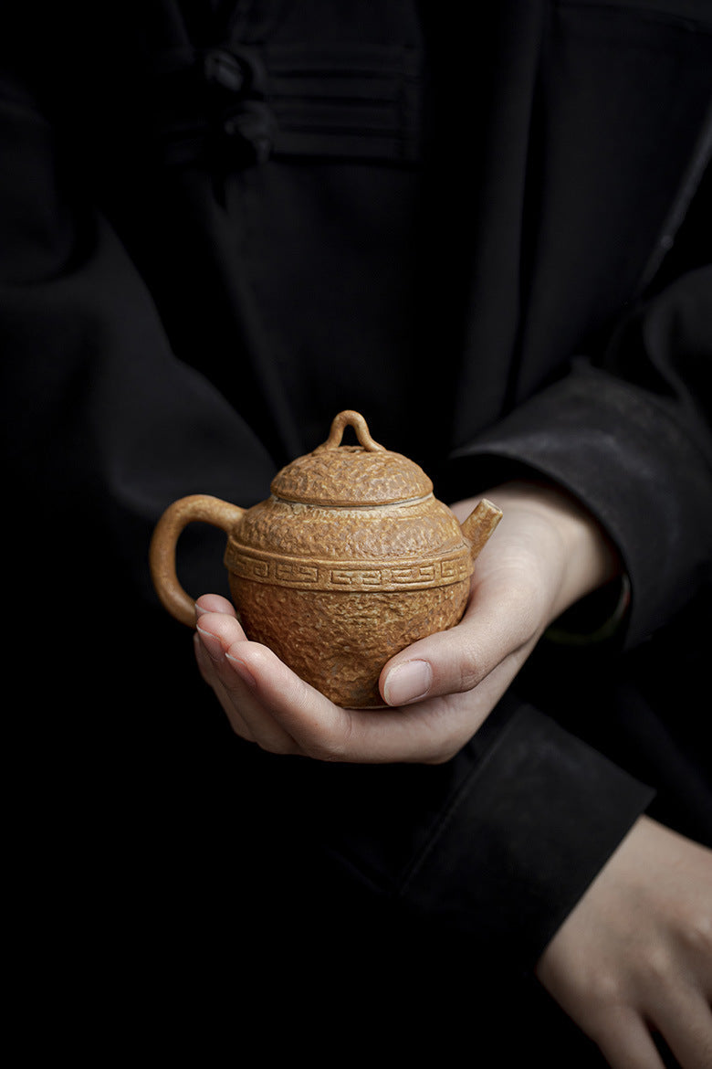 this is a pottery teapot