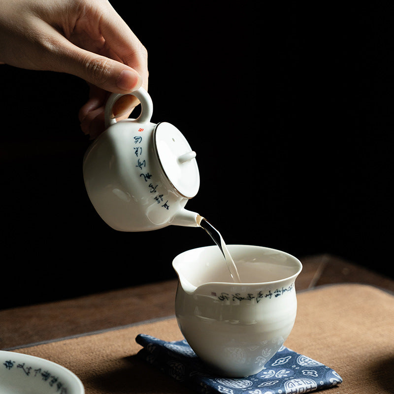 this is a white ceramic teapot