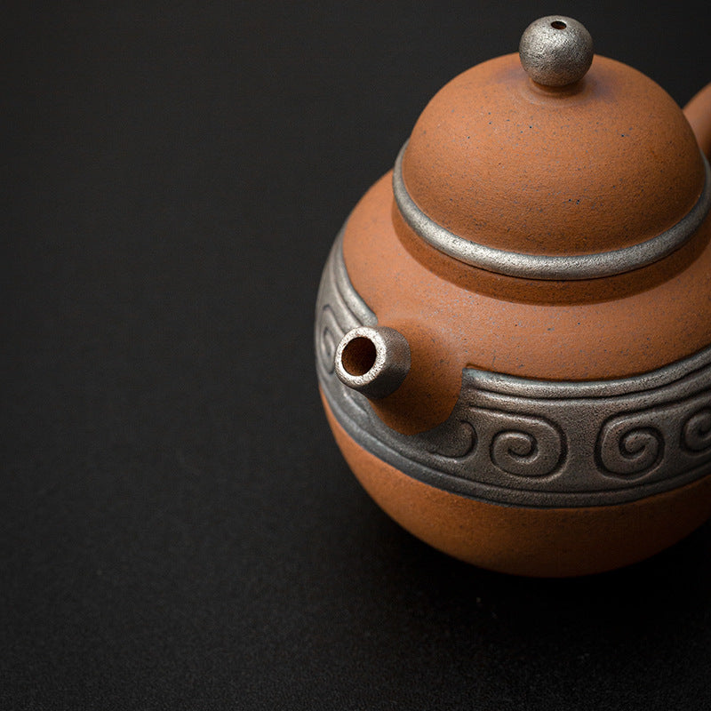 this is a pottery teapot. this is a pear teapot