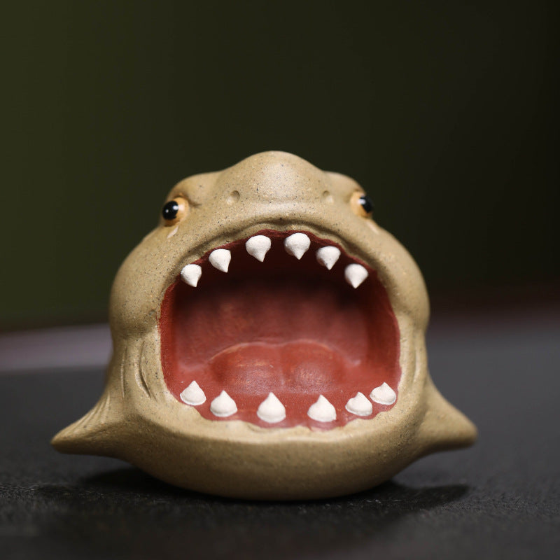 This is Chinese Yixing purple clay shark teapet